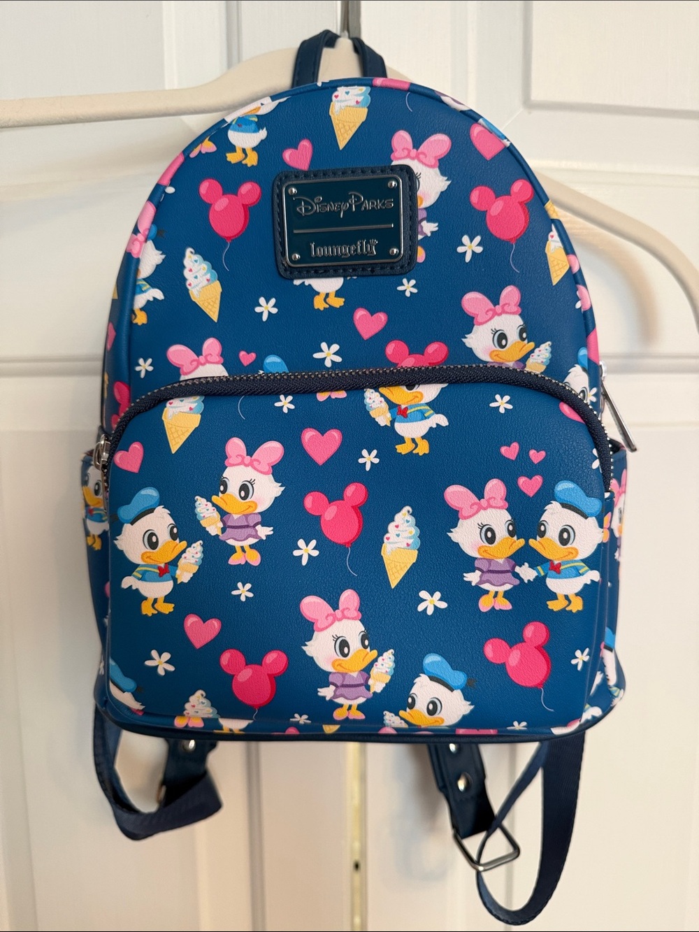 Loungefly Navy Mini Backpack with Pink and Yellow Daisy Duck Pattern